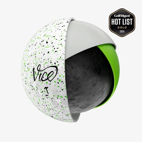 Dwarsdoorsnede van een golfbal met 'Drip Lime' design: witte buitenkant met groene en zwarte spetters, met groen en zwart binnenwerk.