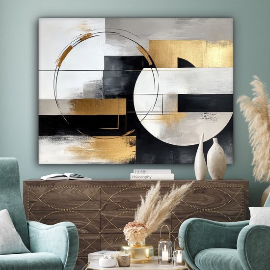 Peinture abstraite avec des formes géométriques dorées, argentées et noires, des cercles et des lignes au-dessus d'une commode.
