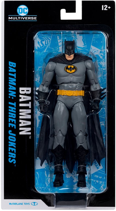 Batman actiefiguur in grijs pak met geel logo, cape en riem, verpakt in doos.