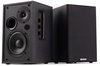 Twee zwarte Audizio luidsprekers, een actieve en een passieve, op een witte achtergrond. De actieve luidspreker heeft een woofer en tweeter.