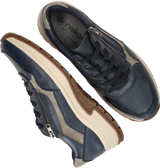Paar blauwe leren Rieker sneakers met ritssluiting en grijze accenten.