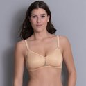Nude beugel-loze bh met kanten randjes en strikjes bij de schouderbandjes.