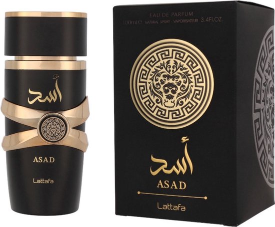 Boîte et flacon noirs avec des détails dorés. Le flacon présente une bande dorée et le texte 'ASAD' en lettres arabes dorées.