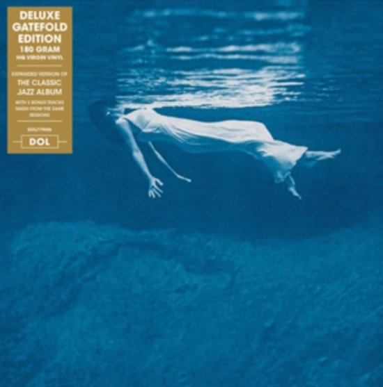 Deluxe gatefold editie 180 gram HQ virgin vinyl, uitgebreide versie van het klassieke jazzalbum met 2 bonusnummers. Vrouw in wit gewaad drijft onder water.