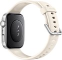 Achterkant van een zilverkleurig smartwatch met een crèmekleurige band, waarop 'HUAWEI' staat.