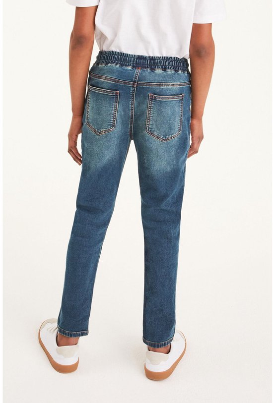 Jongens jeans met elastische tailleband en blauwe wassing.