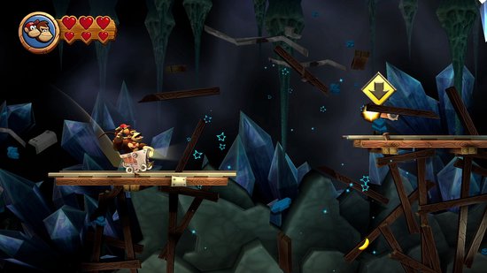 Donkey Kong conduit un chariot minier dans une grot remplie de cristaux.