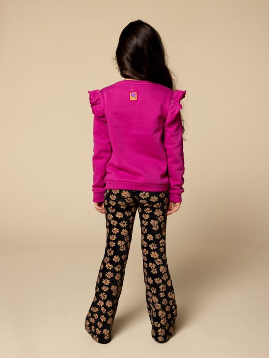 Pantalon en polyester noir avec oeillets, style unique (D'occasion) à Pantalon en polyester noir avec oeillets, style unique (D'occasion) à