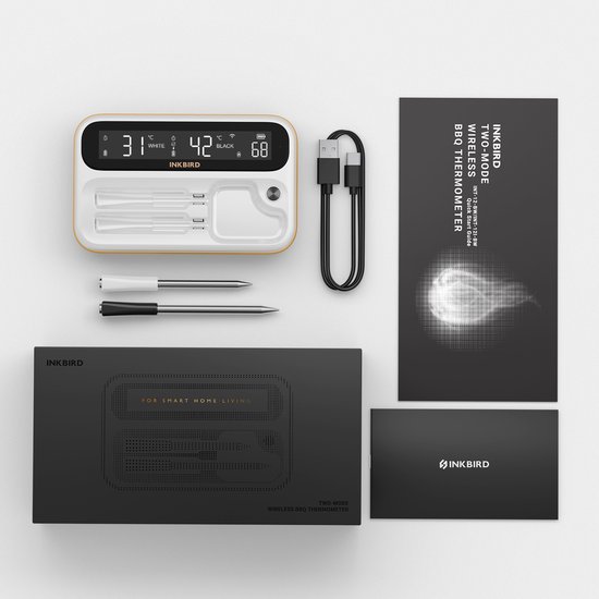 Wit thermometerapparaat, twee sensoren, USB-kabel, handleiding en zwarte geschenkdoos op een donkere achtergrond.