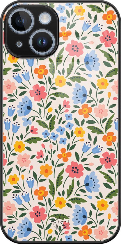 Coque pour iPhone 14 sur fond crème avec un imprimé de fleurs rouges, roses, jaunes et bleues et des feuilles vertes.