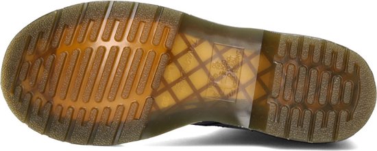 Semelle extérieure d'une botte Dr. Martens noire à lacets avec surpiqûre jaune et semelle distinctive.