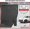 Zwarte mat met honingraatpatroon en origineel bevestigingssysteem, naast een witte auto.