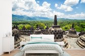 Behang - Fotobehang Witte wolken boven de Borobudur tempel - Breedte 390 cm x hoogte 260 cm