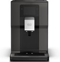 Zwarte Krups Intuition volautomaat met glanzend zwart frontpaneel.