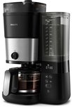 Zwart Philips koffiezetapparaat met zilveren accenten, bonenreservoir en glazen kan.