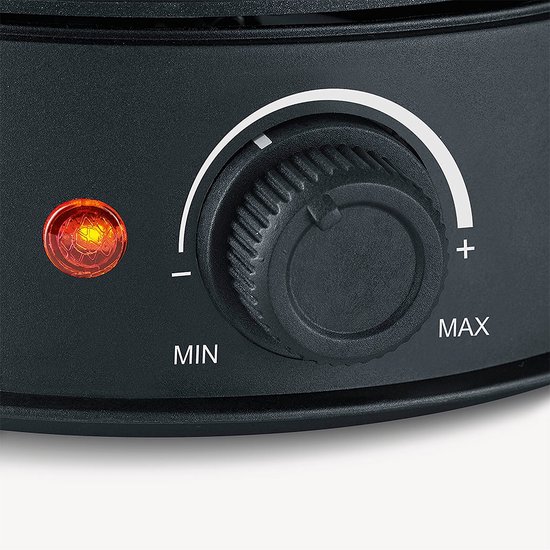 Close-up van de zwarte fonduepan met een draaiknop, een indicatorlampje en de tekst MIN en MAX.