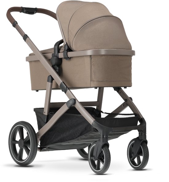 Bruine Deryan kinderwagen met reiswieg en kap, op de grond.
