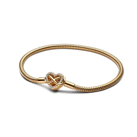 Gouden Pandora armband met een hartvormige sluiting versierd met oneindigheidssymbool en zirkonia.
