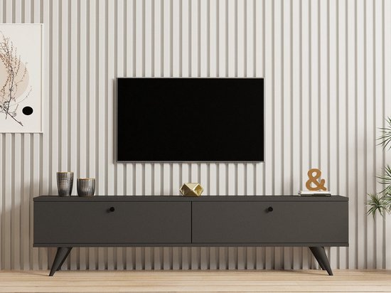 Antraciet tv-meubel met twee lades en taps toelopende pootjes, met decoratie.