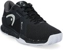 Zwarte tennis schoen met witte spetters op de zool, witte veters en een witte HEAD logo op de zijkant.