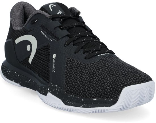 Zwarte tennis schoen met witte spetters op de zool, witte veters en een witte HEAD logo op de zijkant.