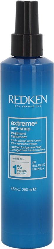 Blauwe fles Redken Extreme Anti-Snap leave-in treatment met zwarte spuitkop. "Extreme anti-snap treatment" en "anti-breakage leave in" op het etiket.