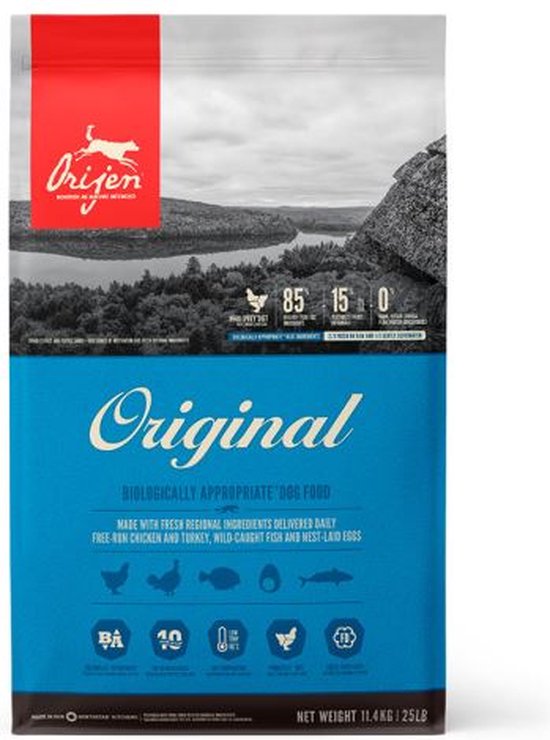 Orijen Original hondenvoer zak met een afbeelding van een meer en rotsen. 85% vlees, 15% groenten, 0% granen.