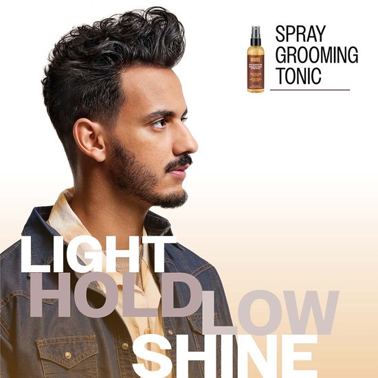 Man met gestyled haar in profiel, met de tekst 'Light Hold, Low Shine' en Reuzel Spray Grooming Tonic.