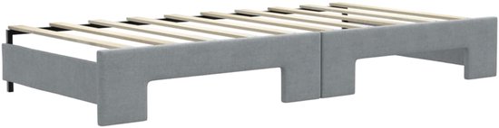 Lichtgrijze bedbodem met houten latten en metalen poten.