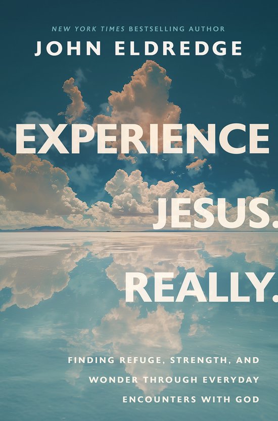 Livre "Experience Jesus. Really." avec texte sur une surface d'eau réfléchissante et des nuages.