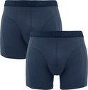 Twee donkerblauwe Ten Cate boxershorts met logo op de tailleband.