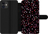 Bookcase Geschikt voor iPhone 12 Pro telefoonhoesje - Een illustratie met hartjes op een zwarte achtergrond - Met vakjes - Wallet case met magneetsluiting
