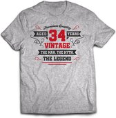 34 Jaar Legend - Feest kado T-Shirt Heren / Dames - Antraciet Grijs / Rood - Perfect Verjaardag Cadeau Shirt - grappige Spreuken, Zinnen en Teksten. Maat S