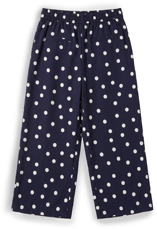 Marineblauwe culotte met witte polkadotprint, wijde pijpen, elastische tailleband en twee achterzakken.