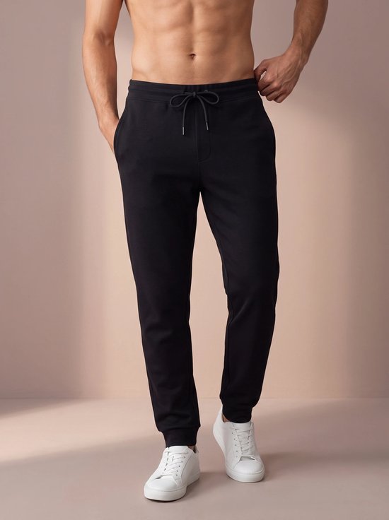 Sjeng Sports NOLAN Trainingsbroek Heren - Zwart - Stretch en zijzakken - Tennis en Fitness - sneldrogend