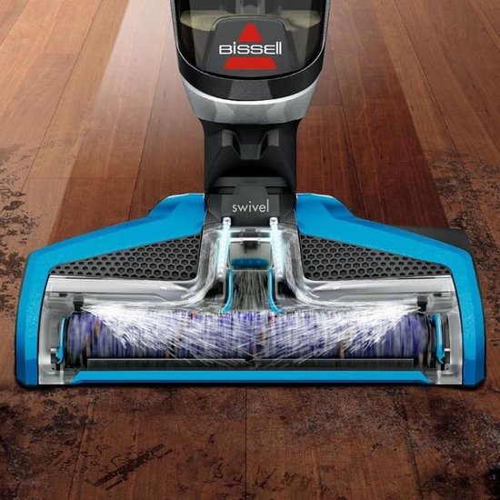 Blauw en grijs Bissell CrossWave vloerreinigingshoofd met roterende borstels op een houten vloer.
