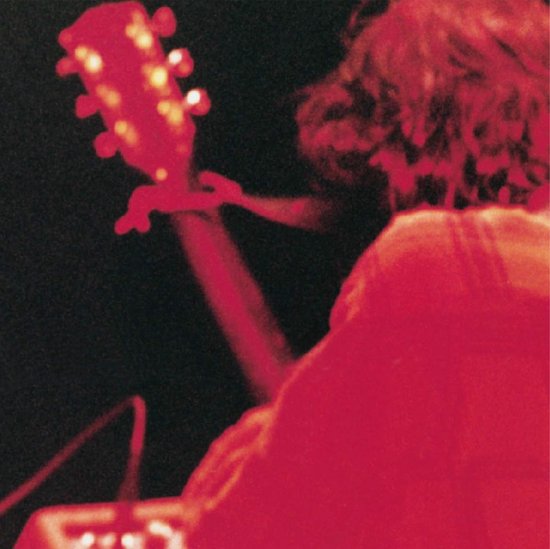 Jeff Buckley met gitaar, rood verlicht, zwarte achtergrond