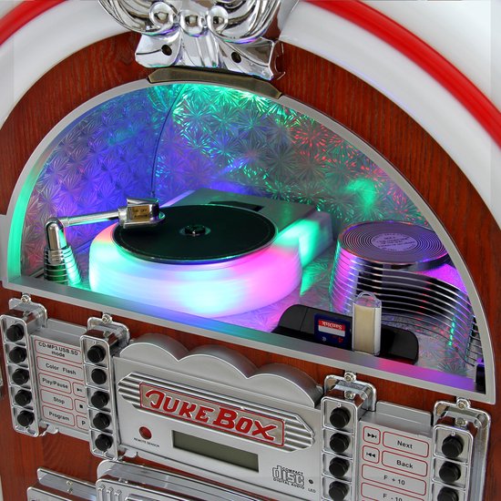Close-up van een jukebox met draaitafel, verlichte binnenkant en bedieningspaneel.