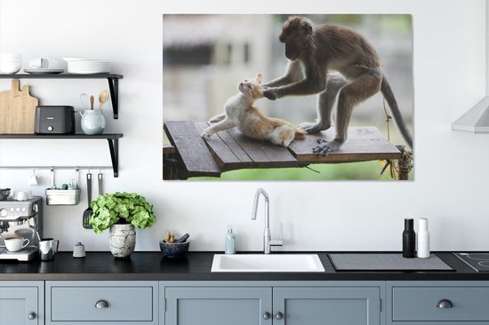 Toile de singe tirant les oreilles de chat 2cm 120x80 cm - Tirage photo sur toile (Décoration murale salon / chambre) / Peintures sur toile pour Animaux domestiques