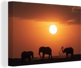 Canvas schilderij 150x100 cm - Wanddecoratie Afrikaanse olifanten tijdens zonsondergang - Muurdecoratie woonkamer - Slaapkamer decoratie - Kamer accessoires - Schilderijen