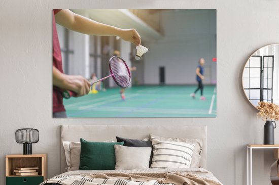 Canvas schilderij 150x100 cm - Wanddecoratie Een man staat op het punt om te badmintonnen - Muurdecoratie woonkamer - Slaapkamer decoratie - Kamer accessoires - Schilderijen op canvas