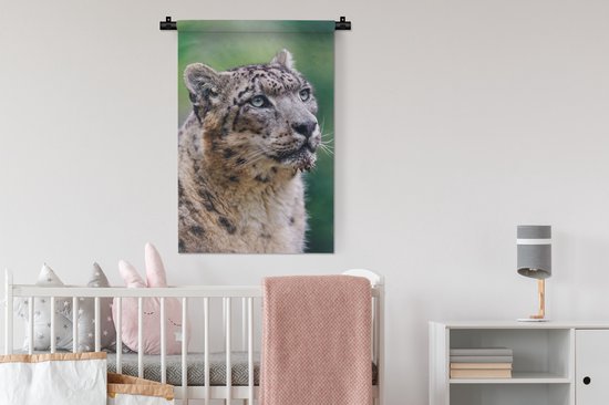 Wandkleed Sneeuwluipaard - Sneeuwluipaard die omhoog kijkt Wandkleed katoen 60x90 cm - Wandtapijt met foto
