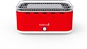 Rode Barbecook Carlo tafel BBQ met verchroomd rooster en zilverkleurige knop.