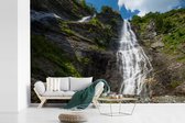 Behang - Fotobehang Wilde waterval in het berglandschap van het Nationaal park Hohe Tauern - Breedte 600 cm x hoogte 400 cm
