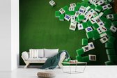 Behang - Fotobehang Verschillende mahjong tegels groene achtergrond - Breedte 450 cm x hoogte 300 cm