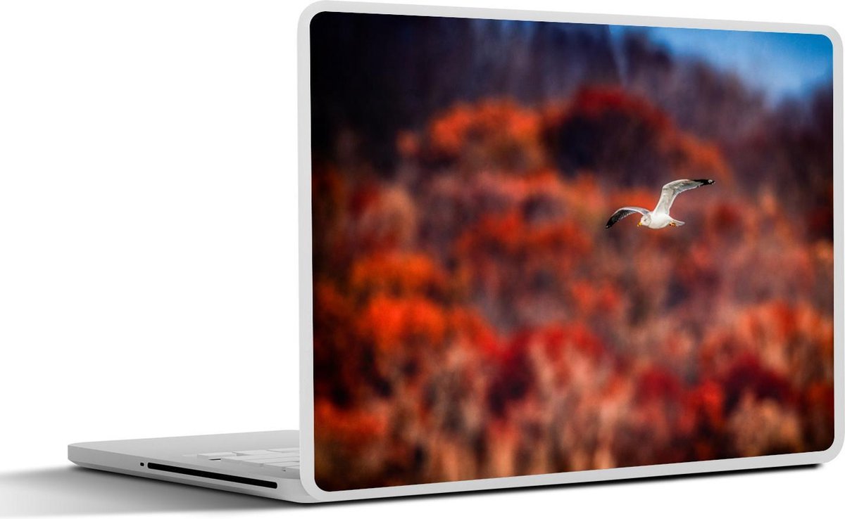 Afbeelding van product SleevesAndCases  Laptop sticker - 13.3 inch - Ringsnavelmeeuw vliegt met een rood-getinte achtergrond