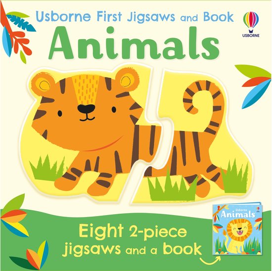 Boek met twee legpuzzelstukken van een oranje tijger met zwarte strepen en groene grasjes. Titel: Usborne First Jigsaws and Book Animals.