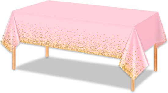 Roze tafelkleed met een patroon van gouden stippen aan de onderrand, tentoongesteld op een tafel.