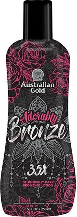 Fles met Australian Gold Adorably Bronze 35X zonnebankcrème, met roze bloemenpatroon op zwarte achtergrond.