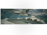 WallClassics - PVC Schuimplaat- Twee Vliegtuigen boven Bergen en Wolken - 60x20 cm Foto op PVC Schuimplaat